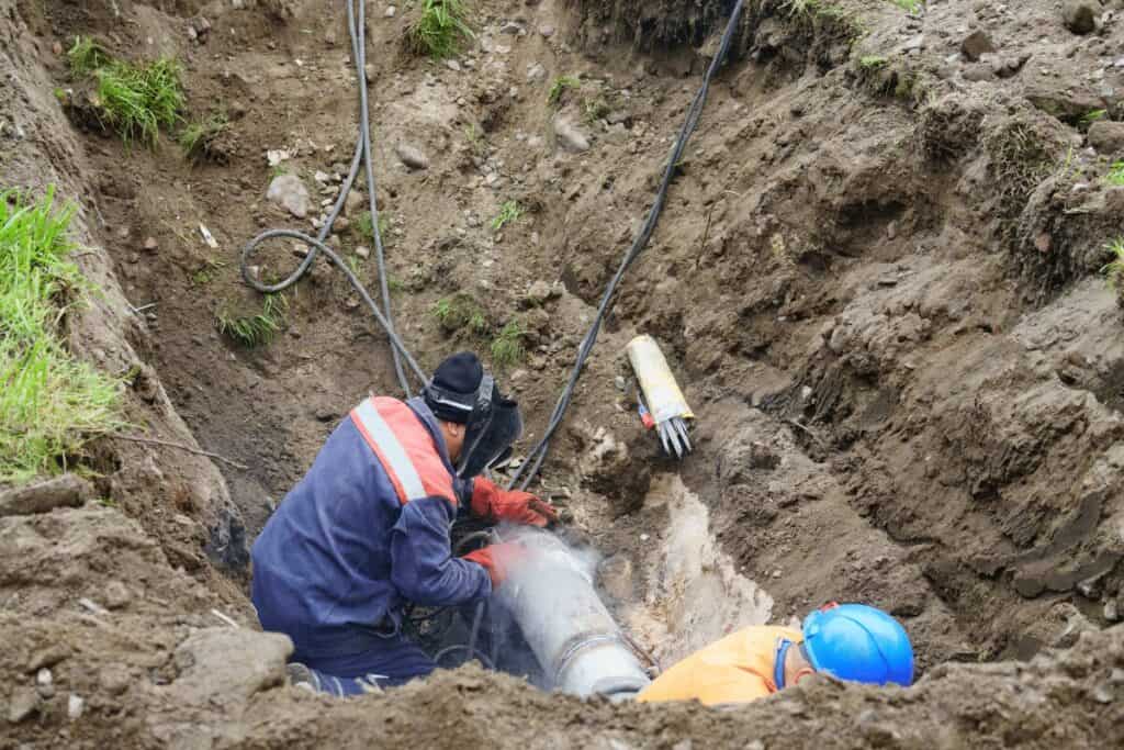 Drain Bros llc workers quickly repair a broken sewer pipe underground, using special tools for a safe and fast solution.