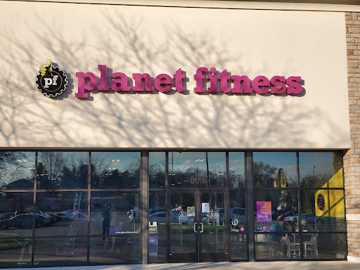 Drain Bros llc is on-site to fix sewer line issues, shown by signs of drainage problems near a local gym entrance.