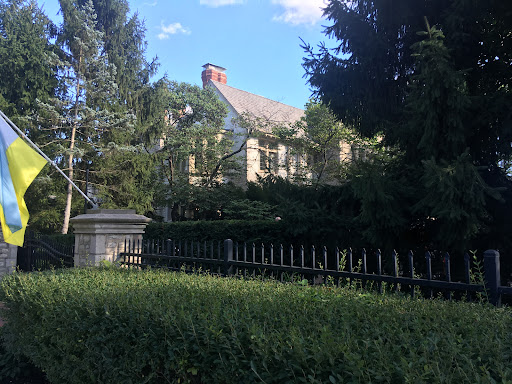 Drain Bros llc just finished a residential septic install at a stone house on a nice, sunny day.