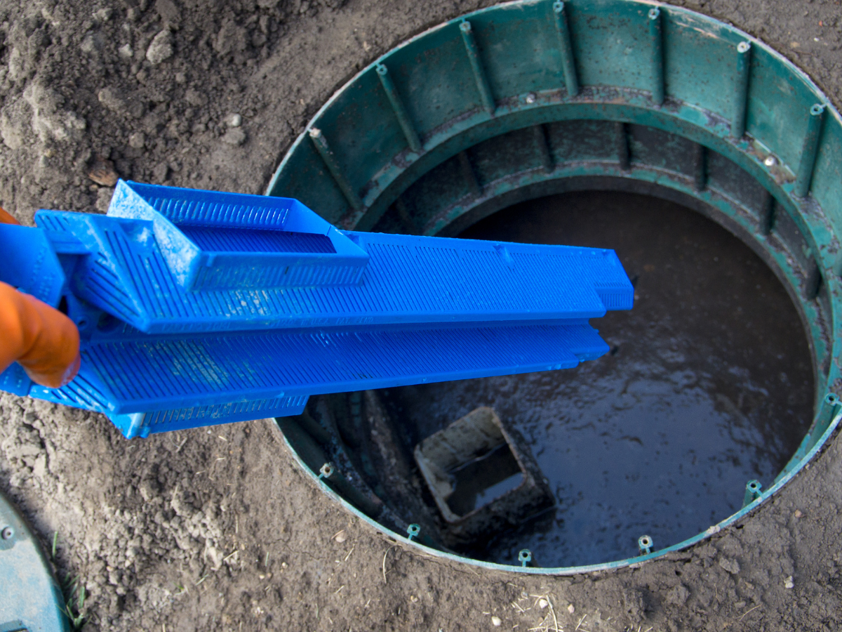 Drain Bros llc helping with septic tank work, showing their service during home drainage system installation or repair.