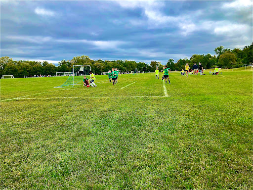 Drain Bros llc helps fix sewer line issues near a park where kids play soccer, keeping the area safe for families.