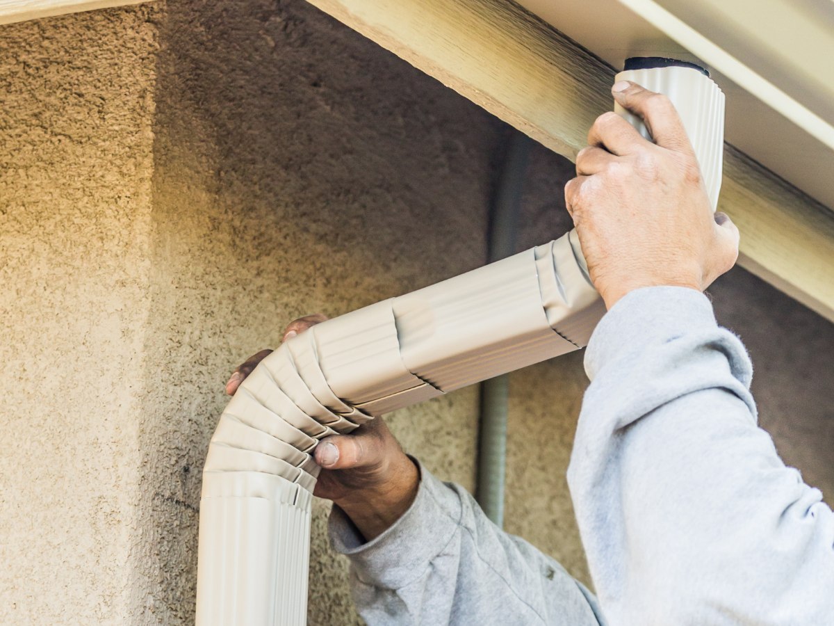 Drain Bros llc shows how to connect a downspout to a gutter, making sure roofs drain water safely and correctly.