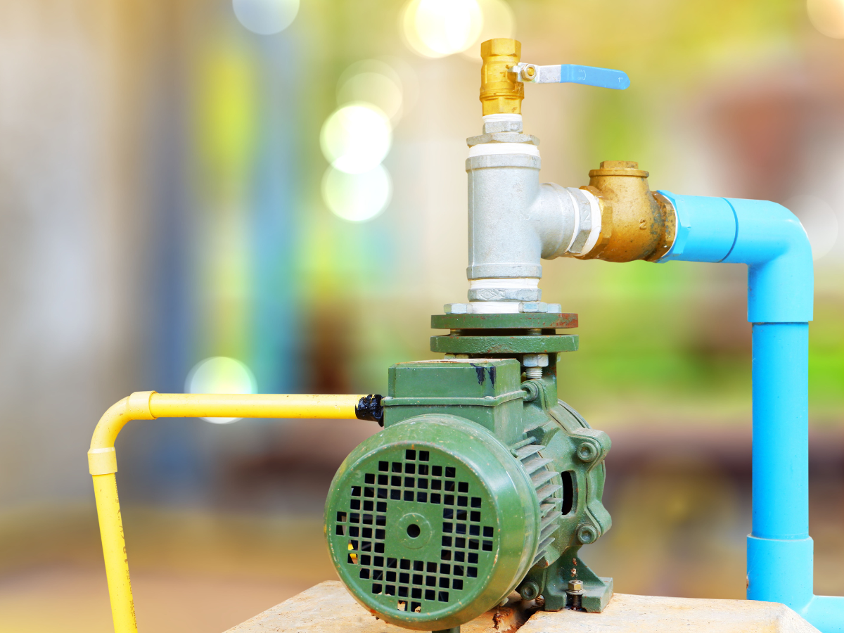 Drain Bros llc installs a water pump system showing their drainage expertise and reliable pipe connections.