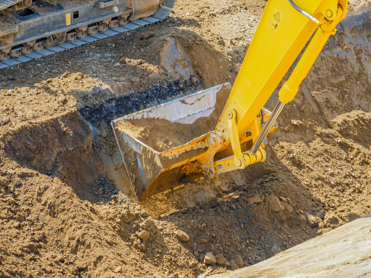 Drain Bros llc at work on a septic installation, showing reliable plumbing and excavation services in action.